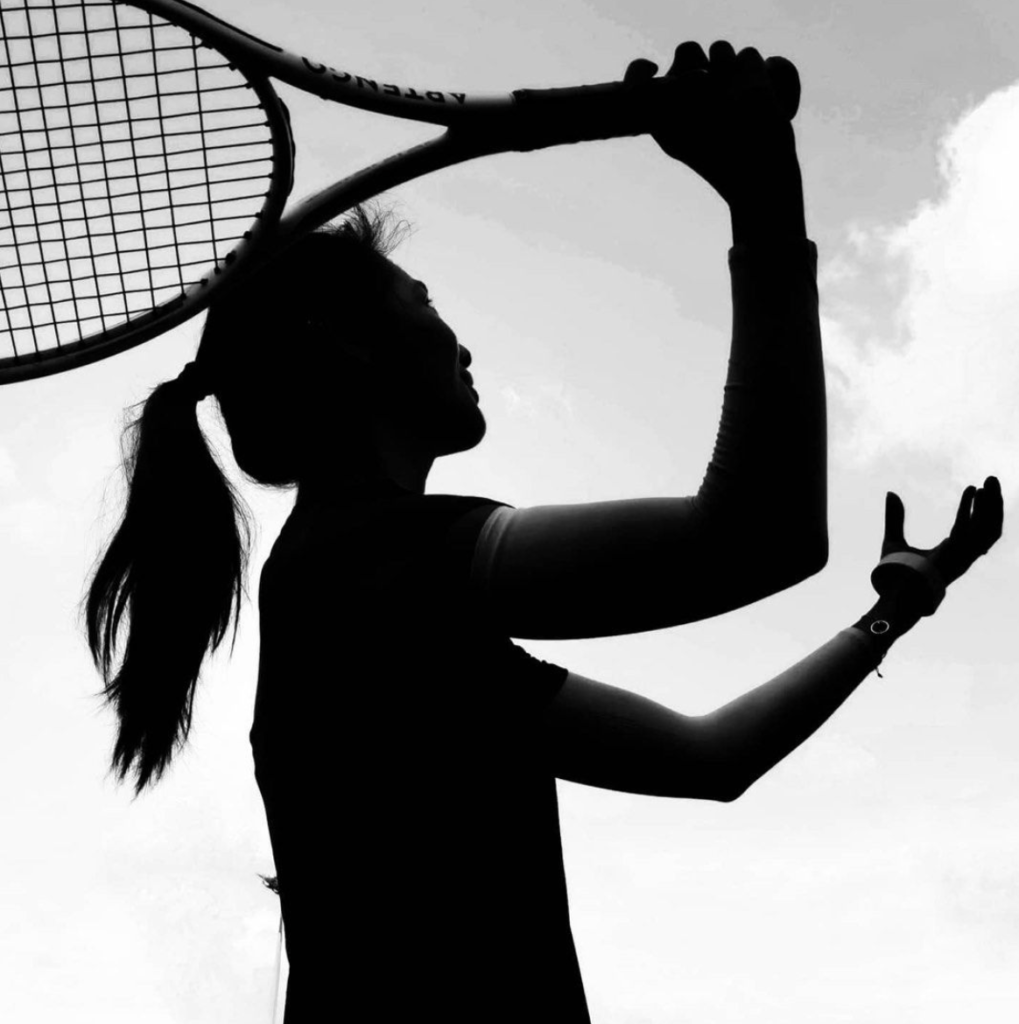 Girl serving in tennis